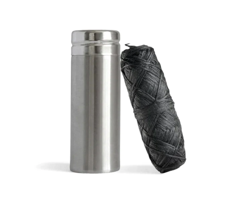 floss in stainless steel container 00X